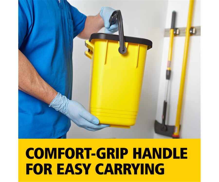 A person wearing gloves holding a yellow bucket with a black handle in a cleaning area with tools in the background. HYGEN™ Yellow Microfiber Charging Bucket (23.8 in. x 9.5 in. x 13.6 in., 3/Case)